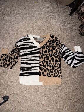 Absolutely Famous Animal Print V-Neck Sweater in Black, White, and Tan